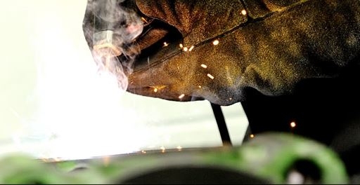 Clarke service engineer working on gas turbine parts