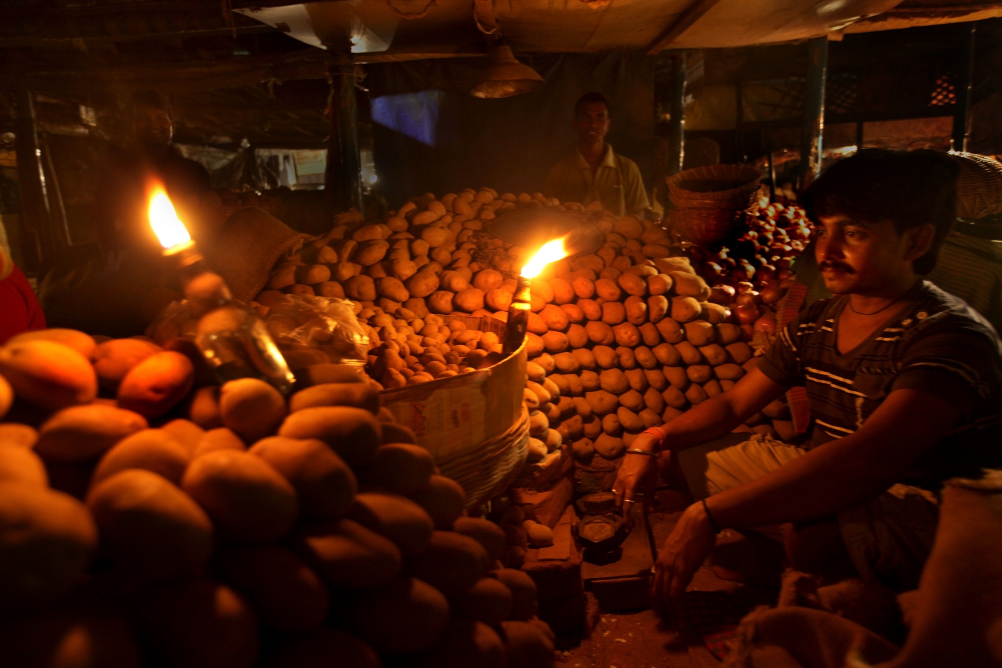 Candle-lit vegetable market during India’s 2012 blackouts