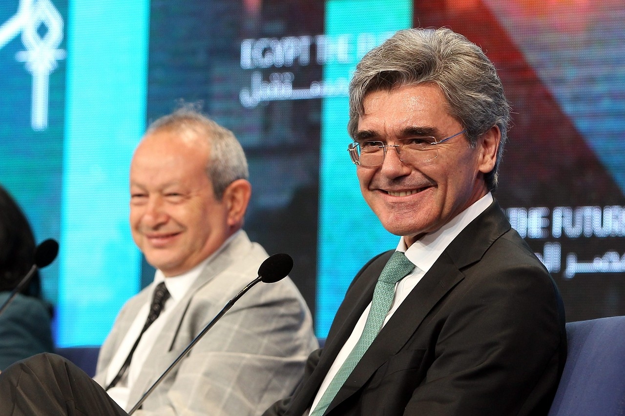 Joe Kaeser, right, and Egyptian businessman Naguib Sawiris at the 2nd day of the summit on Saturday
