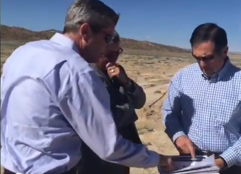 Curt Hildebrand, president of Western Energy Partners, points out the land for the $1 billon project