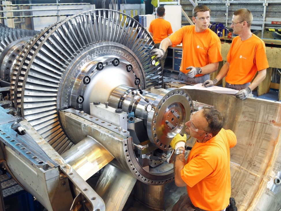 Workers at GE's gas turbine centre in Belfont