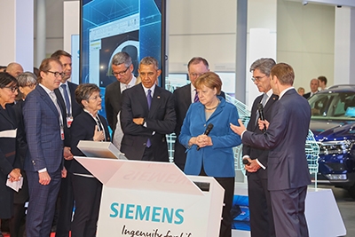 President Obama with German Chancellor Merkel at the Siemens booth