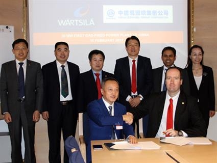 The signing of the deal [source: Wartsila]