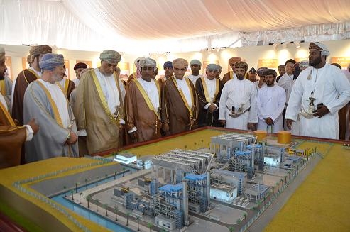 Developers in front of a model of the Salalah IPP at the inauguration ceremony