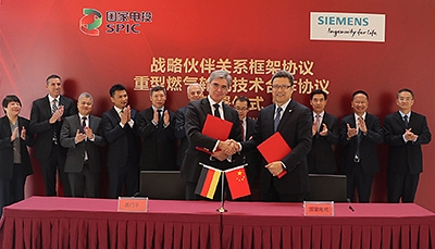 Qian Zhimin, Chairman of SPIC, and Joe Kaeser, Siemens CEO, signed the strategic partnership in Beijing.