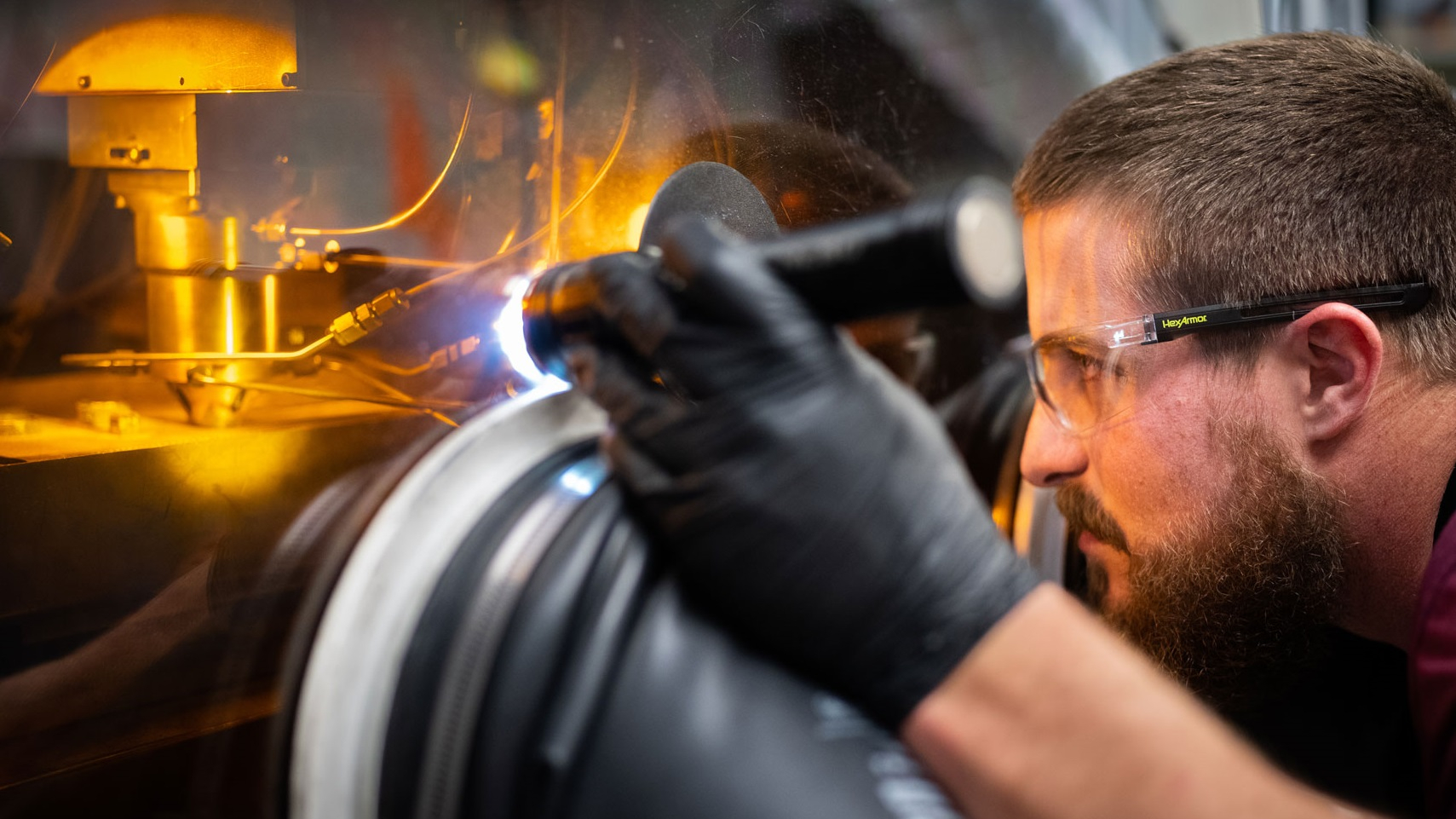 Scientist working on the Laser Engineered Net Shaping machine