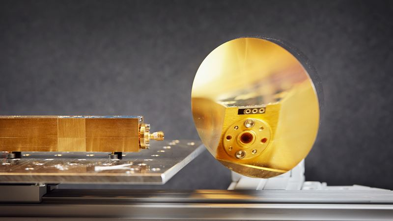 Radar signals are redirected via a gold mirror towards a fluidised bed