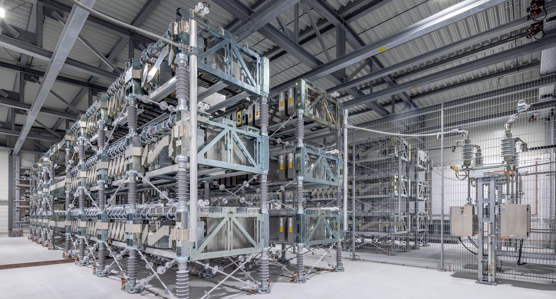 Rows of modular power converters in the E-STATCOM plant in Mehrum
